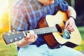 Young man with guitar - closeup