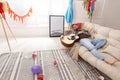 Young man with guitar sleeping on sofa in room after party Royalty Free Stock Photo