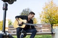 Young man guitar teacher making a videos Royalty Free Stock Photo