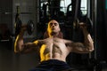 Young Man In Gym Exercising Chest With Dumbbells Royalty Free Stock Photo