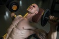 Young Man In Gym Exercising Chest With Dumbbells Royalty Free Stock Photo