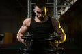 Young Man In Gym Exercising Chest With Dumbbells Royalty Free Stock Photo