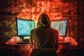 A young man hacker at a computer trying to crack the code, a computer attack on a server