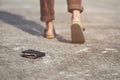 Young man had lost leather wallet with money on the street. Close-up of wallet lying on the road concrete sidewalk Royalty Free Stock Photo