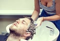 Young man at the hairdresser