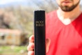 Man hand Holy Bible in nature Royalty Free Stock Photo