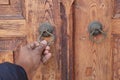 young man hand knocking door, Royalty Free Stock Photo