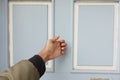 young man hand knocking door, Royalty Free Stock Photo