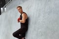 Young Man With Hand Wrap On Wrist Against Concrete Wall. Handsome Caucasian Sportsman With Strong Muscular Body. Royalty Free Stock Photo