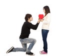 Young Man handing over love gift to young woman