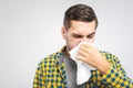 Young man with handkerchief. Sick guy isolated has runny nose. man makes a cure for the common cold Royalty Free Stock Photo