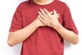 young man hands holds his left chest, chest pain concept from Myocarditis or pericarditis caused by immune system,bacteria or vir