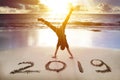 man handstand on the beach.happy new year 2019 concept Royalty Free Stock Photo