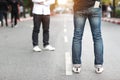 Young man has cell phone in pocket jean on street Royalty Free Stock Photo