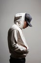 Young Man in Hat and Hood. Boy in a hooded sweatshirt Royalty Free Stock Photo