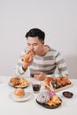 Young man have fast food breakfast Royalty Free Stock Photo