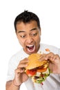 Young Man have a great desire to eat a burger Royalty Free Stock Photo