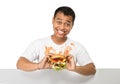 Young man have a great desire to eat a burger Royalty Free Stock Photo