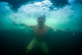 Young man haves recreational winter swim