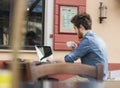 Young man having a coffee break at the bar Royalty Free Stock Photo