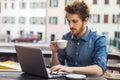 Young man having a coffee break at the bar Royalty Free Stock Photo