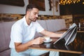 Young man having cup of coffee reading newspaper Royalty Free Stock Photo