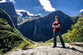 Young man is having fun hiking in Briksdalsbreen, Norway Royalty Free Stock Photo