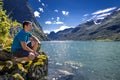 Young man is having fun hiking in Norway Royalty Free Stock Photo