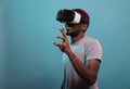 Young man having fun with interactive virtual reality headset