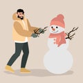 Young man having fun making snowman vector