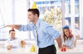 Young man having fun at office party