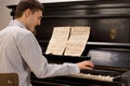 Young man having fun playing the piano Royalty Free Stock Photo