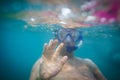 Young man having fun and taking underwater selfie Royalty Free Stock Photo