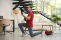 Young man having fun while vacuuming in living room Royalty Free Stock Photo