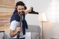 Young man having fun while vacuuming Royalty Free Stock Photo