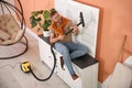 Young man having fun while vacuuming at home Royalty Free Stock Photo
