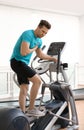 Young man having heart attack on treadmill Royalty Free Stock Photo