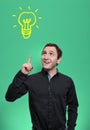 Young man having an idea with light bulb over his head Royalty Free Stock Photo