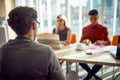 A young man is having an interview for a job position in front of a commission. Business, people, company Royalty Free Stock Photo