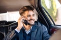 Young man having phone call in limousine Royalty Free Stock Photo