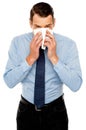 Young man having severe cold. Sneezing Royalty Free Stock Photo