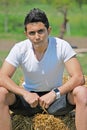 Young man on hay bale Royalty Free Stock Photo