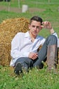 Young man on hay bale Royalty Free Stock Photo