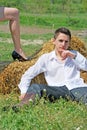 Young man on hay bale Royalty Free Stock Photo