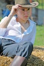 Young man on hay bale Royalty Free Stock Photo