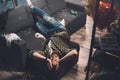 Young man with headache and hangover lying on sofa after party Royalty Free Stock Photo