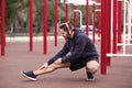 Young man with headphones listening to music and exercising Royalty Free Stock Photo