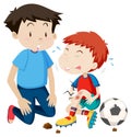 Young man helps hurt soccer player Royalty Free Stock Photo