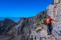 A young man and hiker hiking on table mountain cape town