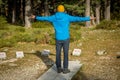 Young man hiker with stone sundial in the middle of the forest in Cercedilla, Madrid Royalty Free Stock Photo